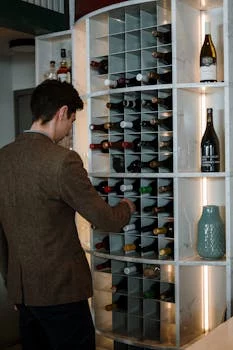 sommelier selecting wine bottles carefully